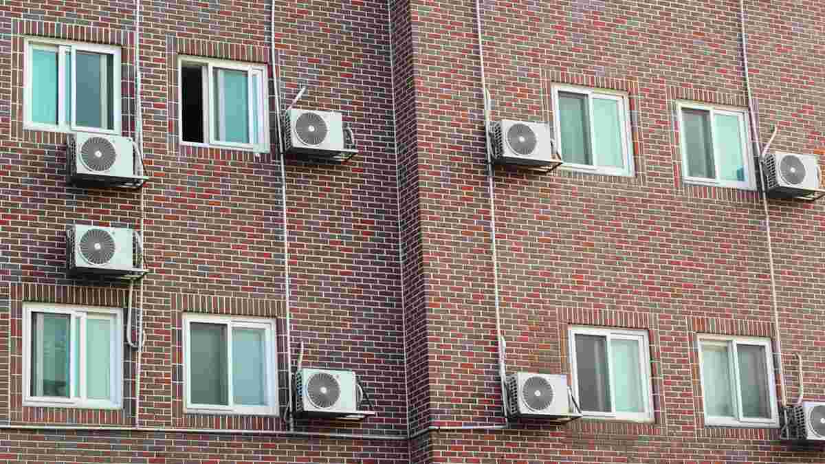 Building wall with windows and air conditioning